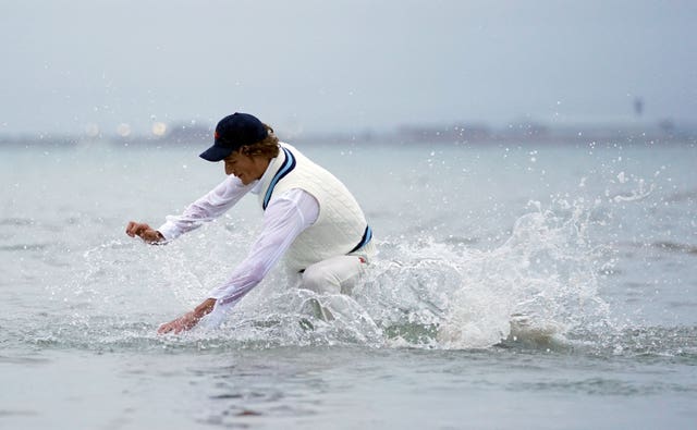 A fielder dives in (Andrew Matthews/PA)