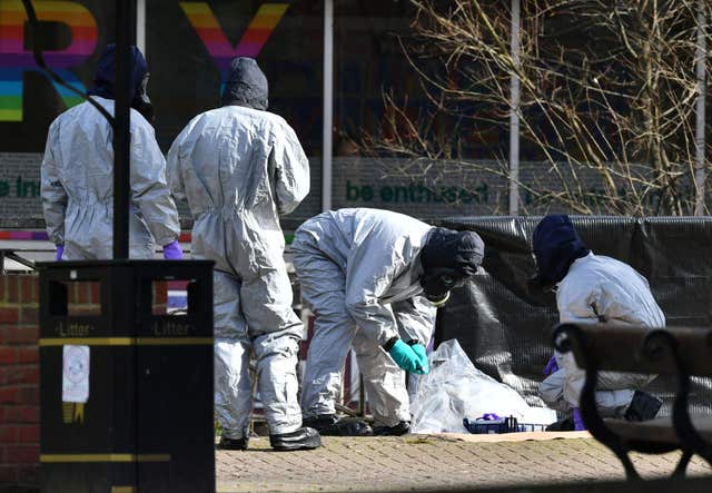 Police in protective suits working near to the scene in the Maltings shopping centre in Salisbury, where former Russian double agent Sergei Skripal and his daughter Yulia, were found critically ill by exposure to Novichok nerve agent (Ben Birchall/PA)