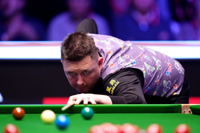 Kyren Wilson plays a shot from the top cushion