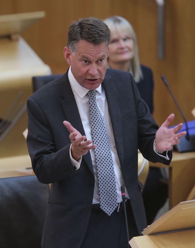 Murdo Fraser stands up to speak inside Holyrood chamber