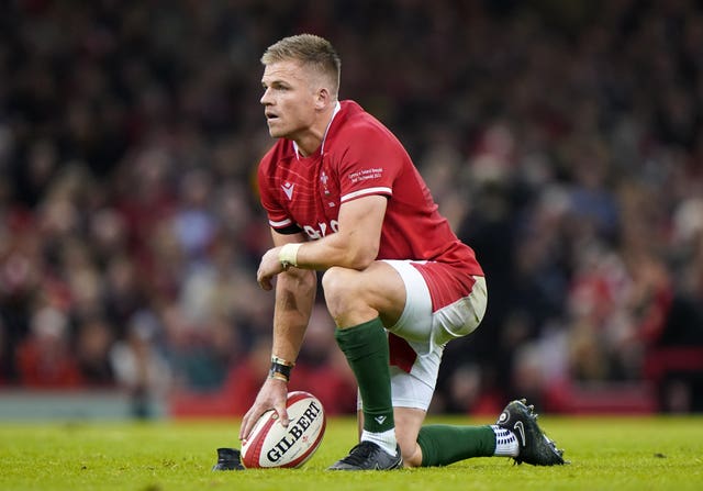 Gareth Anscombe crouches on the pitch for Wales