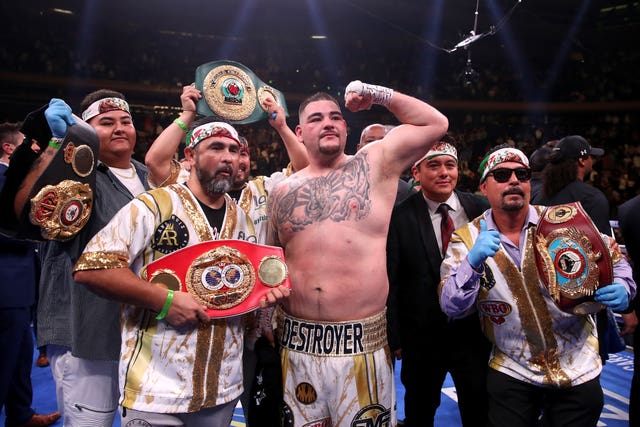 Joshua has vowed to win back the belts he lost to Andy Ruiz Jr (centre) 