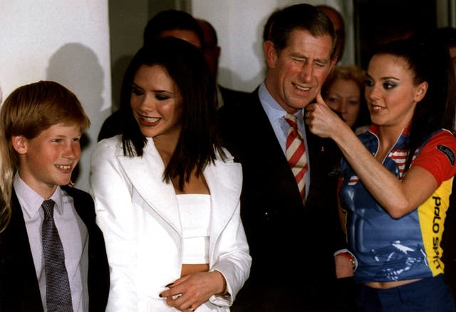 Prince Harry poses with “Posh Spice” and the then-Prince of Wales before the Spice Girl's concert in Johannesburg 