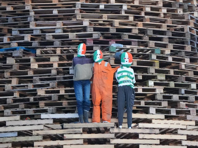 Effigies of controversial Irish rappers Kneecap on a bonfire