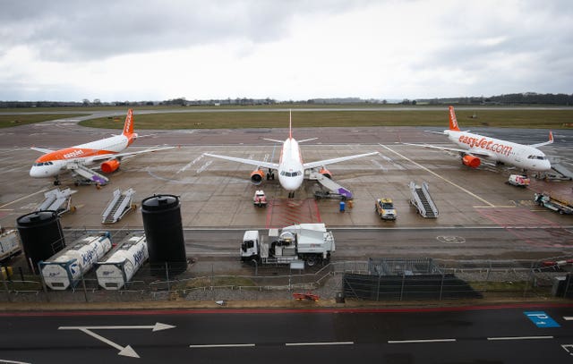 EasyJet planes sit on the tarmac at Luton Airport in Bedfordshire