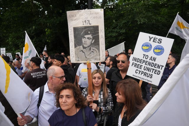 Protesters holding placards