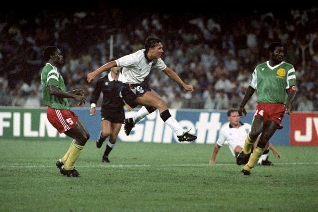 Gary Lineker, centre, takes a shot against Cameroon in 1990