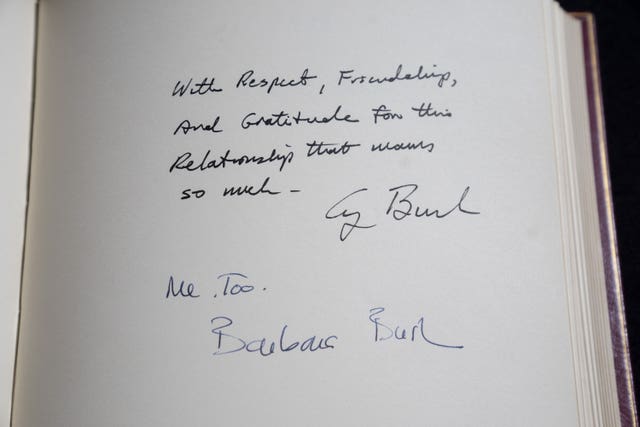 The signatures of US President George Bush and his wife Barbara are seen in one of three Downing Street Visitors Books at the National Archives