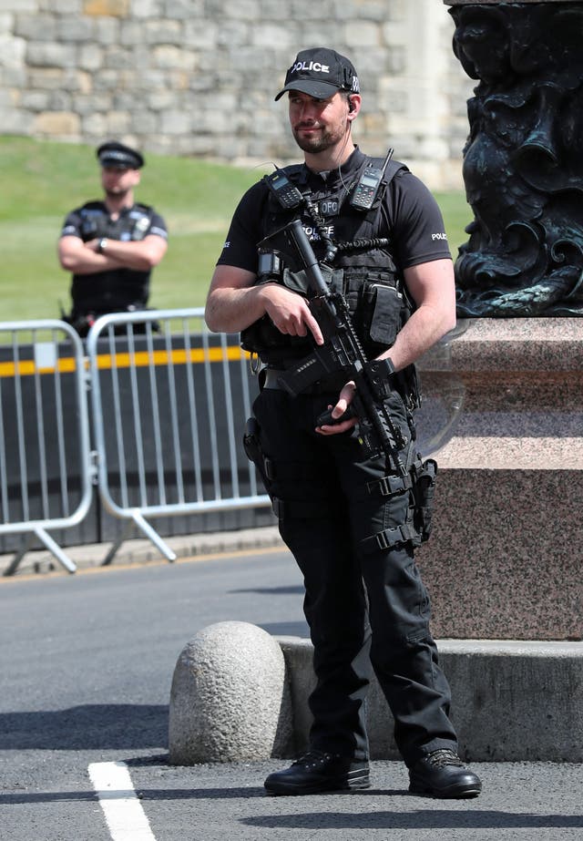 Armed police outside Windsor Castle ahead of the wedding of Prince Harry and Meghan Markle on Saturday (Steve Parsons/PA)