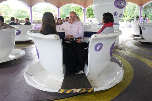 Liberal Democrats leader Sir Ed Davey sat on a teacup ride during a visit to Thorpe Park in Chertsey, Surrey, whilst on the General Election campaign trail 