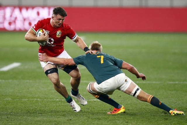 South Africa's Pieter-Steph du Toit, right,  tackles Tom Curry of the British and Irish Lions