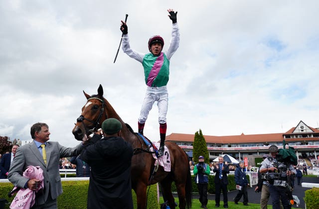 Frankie Dettori celebrates winning the Boodles Chester Vase Stakes with Arrest 