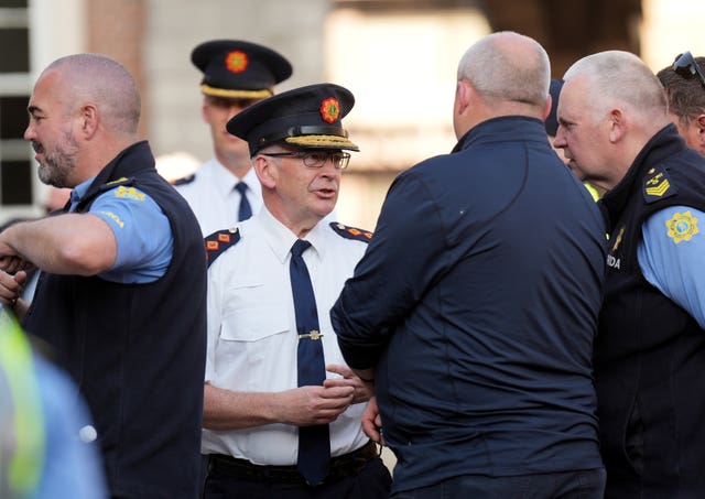 Garda Commissioner Drew Harris (centre) arrives at Dublin Castle for a memorial service