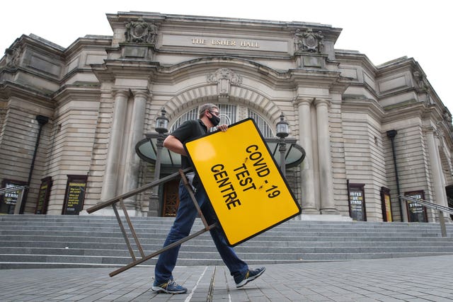 Signs are put in place at a new walk-through testing centre at the Usher Hall in central Edinburgh (Andrew Milligan/PA)