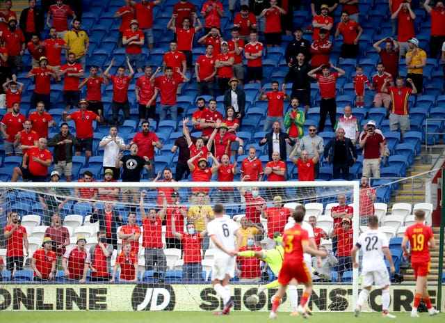 Wales fans react as Neco Williams has a shot at goal