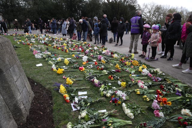 Some flowers have been left outside Windsor Castle following Philip's death (Steve Parsons/PA)