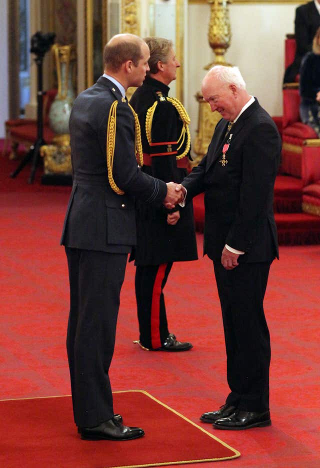 Peter Lawrence receives his honour from the Duke of Cambridge