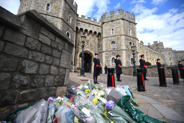 Flowers left outside Windsor Castle following the announcement of the death of the Duke of Edinburgh