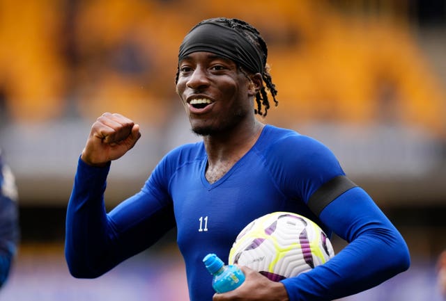 Chelsea's Noni Madueke smiles with the match ball