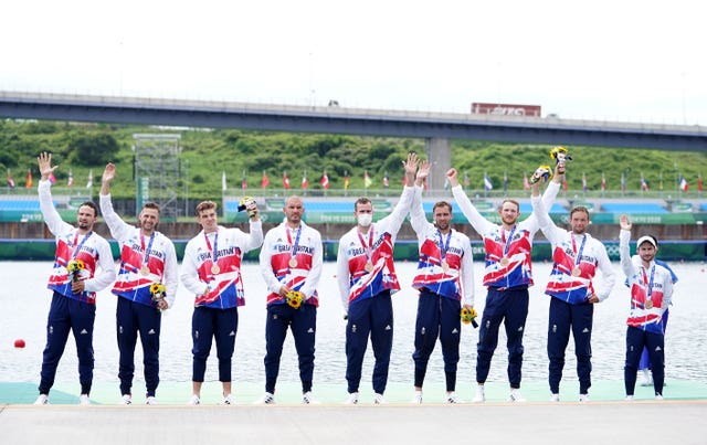 Great Britain’s Josh Bugajski, Jacob Dawson, Tom George, Mohamed Sbihi, Charles Elwes, Oliver Wynne-Griffith, James Rudkin, Tom Ford and Henry Fieldman (Cox) receive their bronze medals