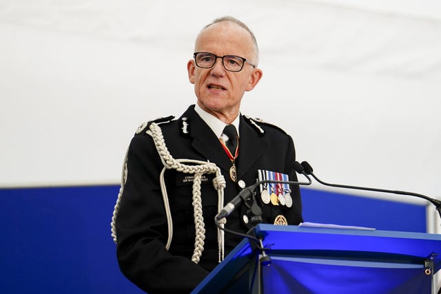 Sir Mark Rowley standing behind a podium giving a speech