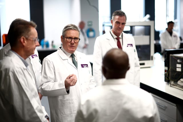 Prime Minister Sir Keir Starmer speaks with researchers and professors during a visit to the Manufacturing Futures Lab at University College London East