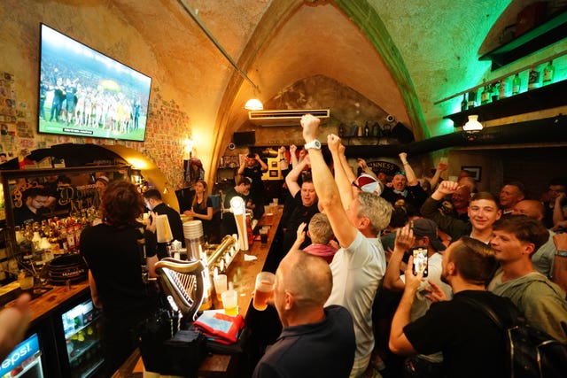 West Ham United fans watch the trophy presentation in a pub in Prague, following the Uefa Europa Conference League final