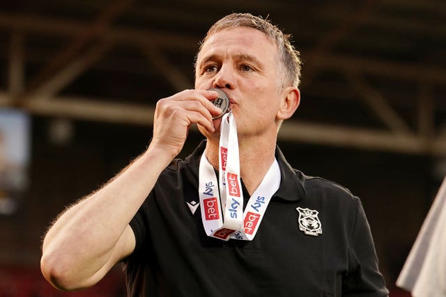 Wrexham manager Phil Parkinson celebrates after Sky Bet League One promotion