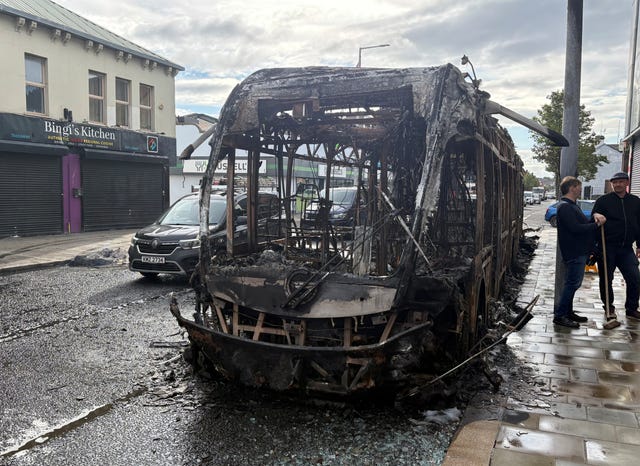 The wreckage of a Glider bus which was torched on Newtownards Road in east Belfast