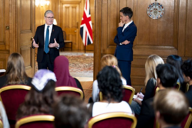 Sir Keir Starmer talking to sixth formers