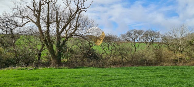 A parachute in a tree of one of the pilots of a Royal Navy Hawk jet which crashed in woodland in Cornwall 