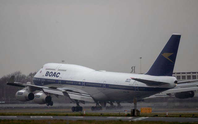 A Boeing 747 in British Overseas Airways Corporation (BOAC) livery, the first aircraft in British Airways’ centenary fleet, arrives at London’s Heathrow Airport (Steve Parsons/PA)