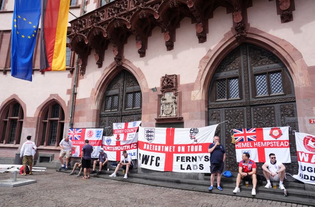 England fans pictured next to St George's flags in Frankfurt ahead of the Euro 2024 group match against Denmark