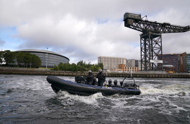 Ministry of Defence Police Marine Unit demonstrate manoeuvres on the River Clyde as they take part in a training session next to the Scottish Event Campus, the venue for Cop26 summit in Glasgow (Andrew Milligan/PA)