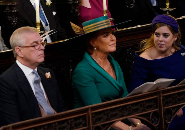 Beatrice with her parents the Duke of York and Sarah, Duchess of York in the front row of the pews at Eugenie's wedding in 2018