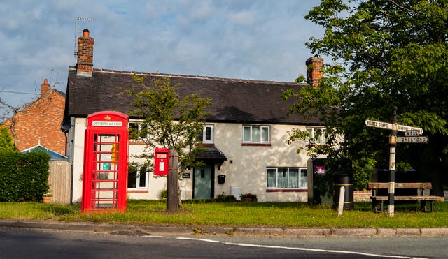 Some former red telephone boxes have been converted into places to store community defibrillators (Peter Byrne/PA)