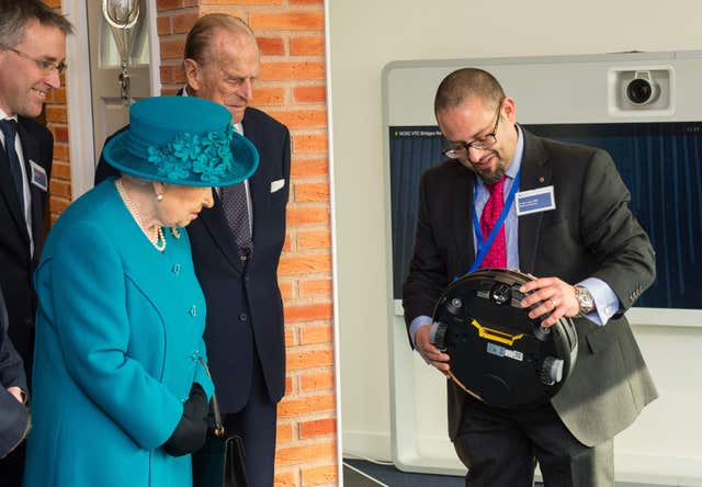 Dr Ian Levy meeting the Queen and the Duke of Edinburgh at GCHQ (Dominic Lipinski/PA)