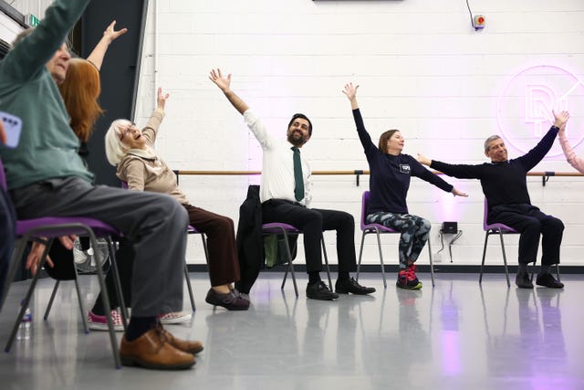 Humza Yousaf took part in chair dancing during a visit to a community project in Edinburgh 
