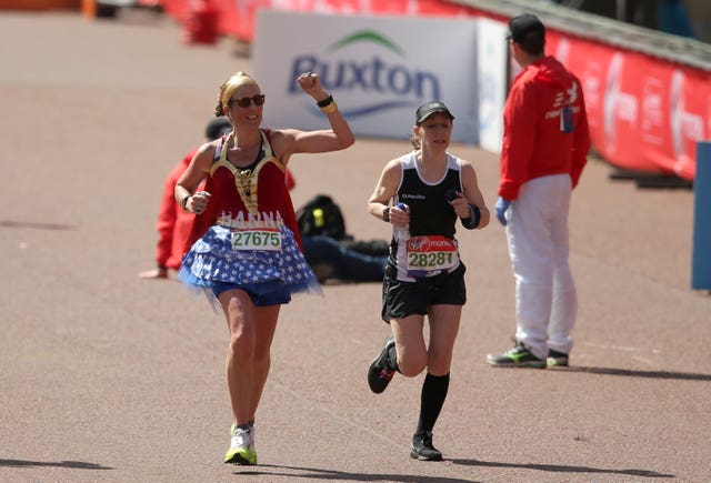 Runners in fancy dress during the marathon (Paul Harding/PA)