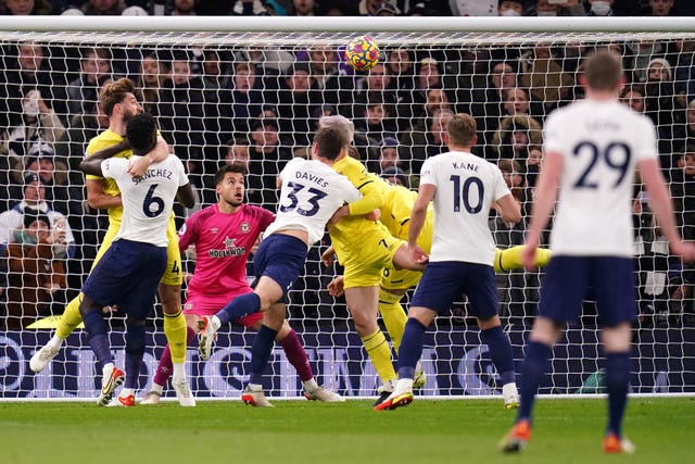 Sergi Canos, centre, scores an own goal to put Tottenham ahead