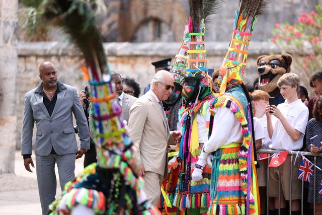 The King with members of the National Gombey Dance Troupe