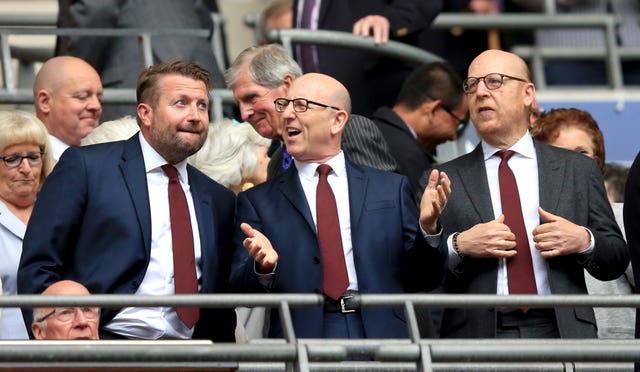 Manchester United chief executive Richard Arnold with co-chairmen Joel Glazer and Avram Glazer