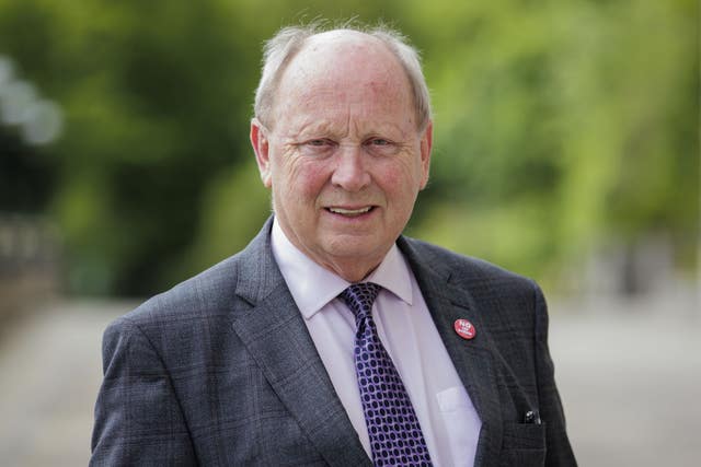 A close-up of TUV leader Jim Allister in a suit and tie