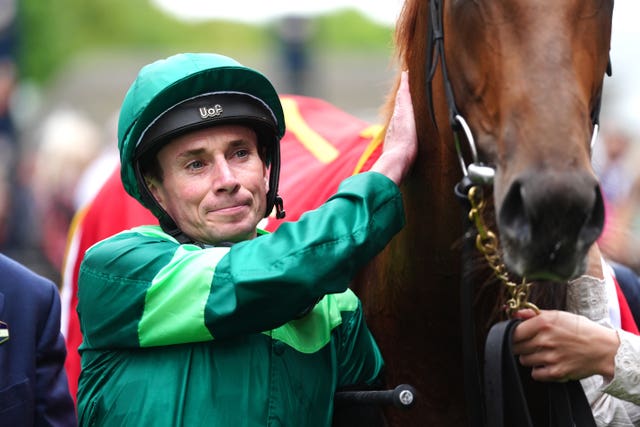 Ryan Moore gives Whistlejacket a well-deserved pat after victory at Newmarket 