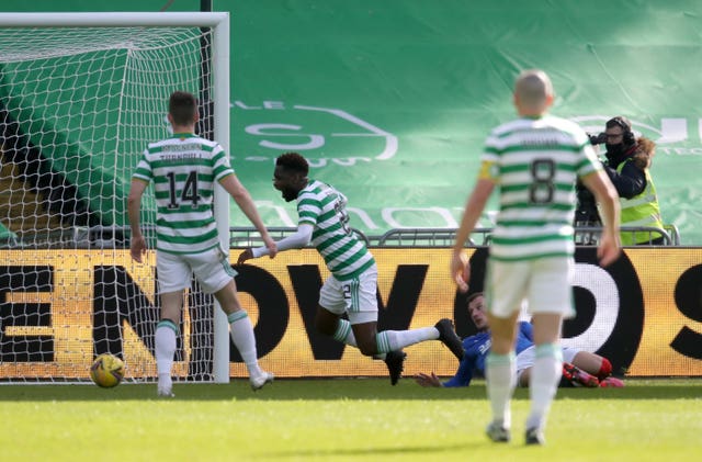 Celtic's Odsonne Edouard (centre) goes to ground as Borna Barisic slides in