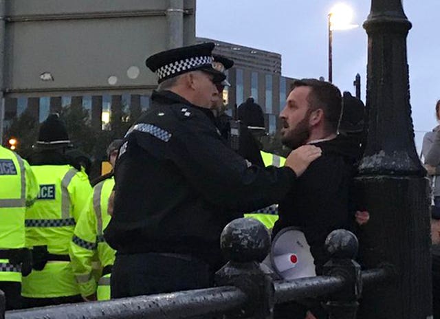 James Goddard is held by police in Salford 