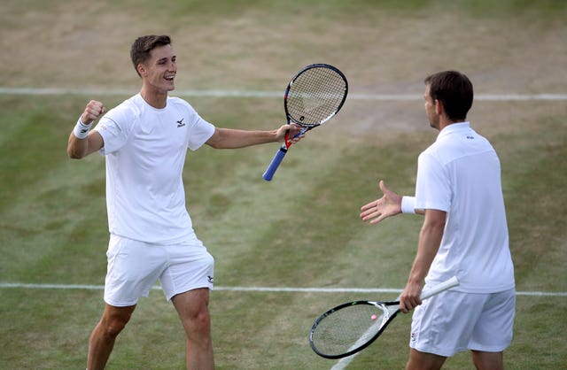 Joe Salisbury (left) and Frederik Nielsen celebrate winning ta match at Wimbledon in 2018 
