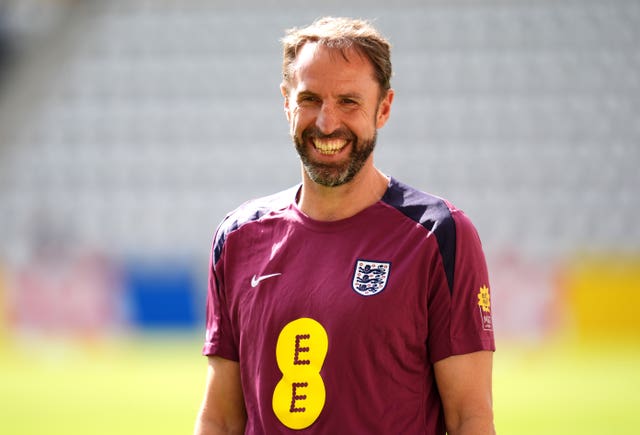 England head coach Gareth Southgate smiling at training