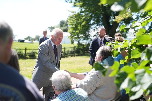 King Charles III speaks with well wishers after attending a Sunday church service at St Mary Magdalene Church in Sandringham, Norfolk