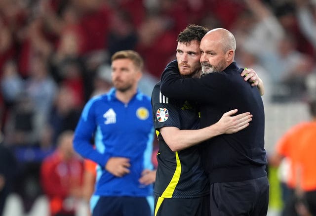 Scotland’s Andrew Robertson and manager Steve Clarke console each other after exiting the tournament 